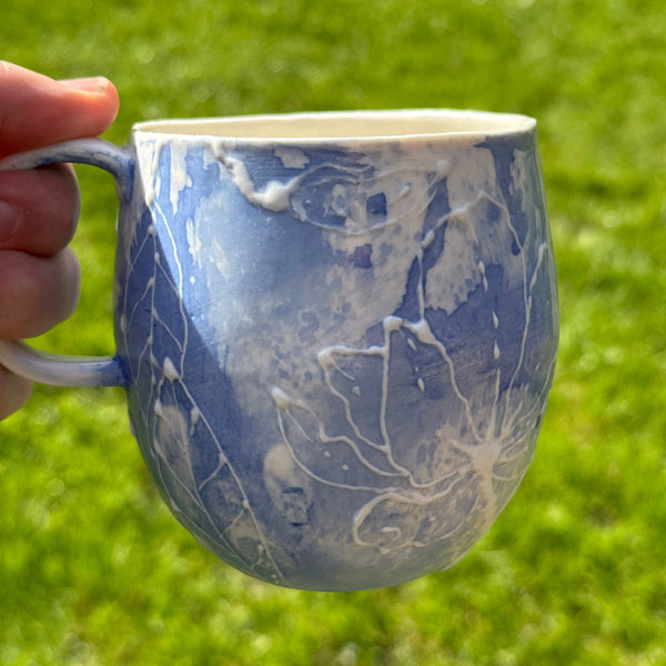 Blue porcelain mug (slip trailed)