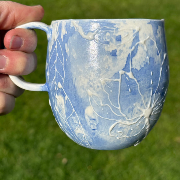 Blue porcelain mug (slip trailed)