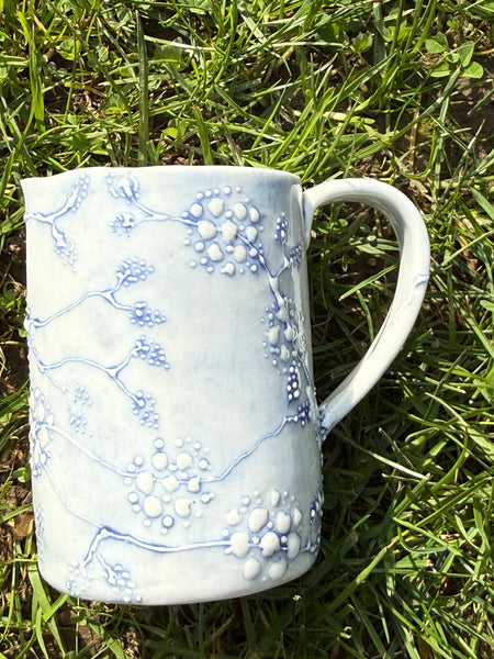 Blue porcelain jug (slip trailed)