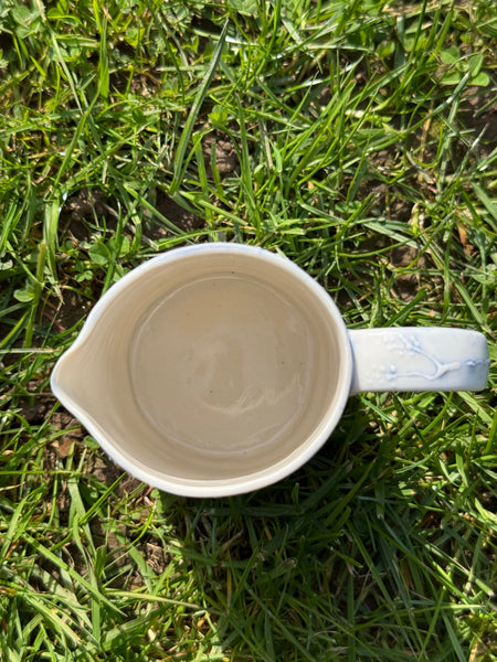 Blue porcelain jug (slip trailed)