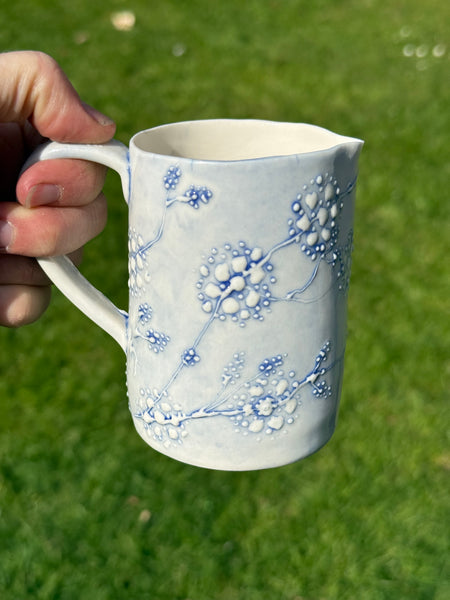 Blue porcelain jug (slip trailed)