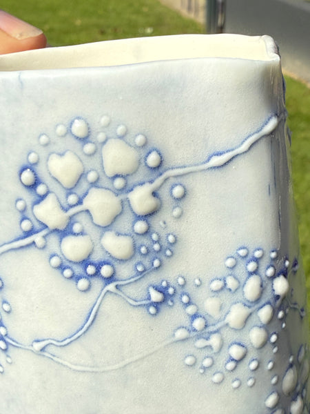 Blue porcelain jug (slip trailed)