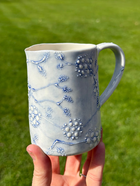 Blue porcelain jug (slip trailed)